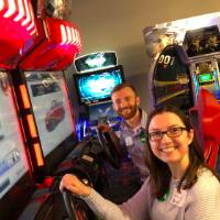 Two people playing arcade games